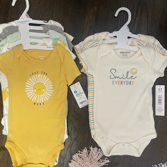 Carter's Other - Gender neutral onesies size 9 months. Never worn tags on.